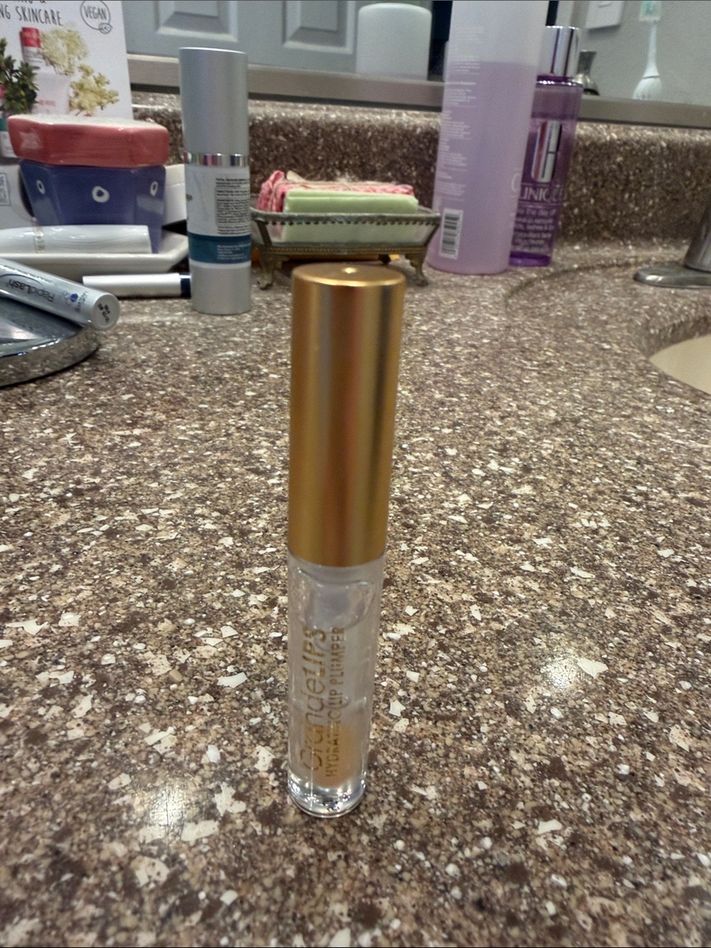 Gold-Capped Clear Lip Gloss by — Hydrating Shine